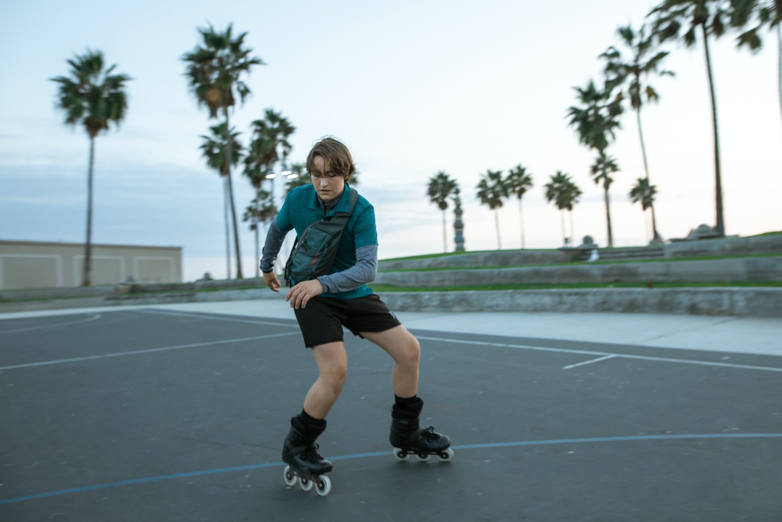 A Young Man Rollerblading for Recreation