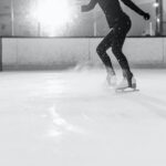 Grayscale Photography of a Person Ice Skating