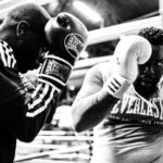 two men wearing boxing gloves