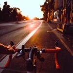 person riding on bicycle on road