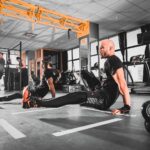 woman in black tank top and black leggings doing exercise