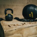 black metal kettle bell and heavy bag